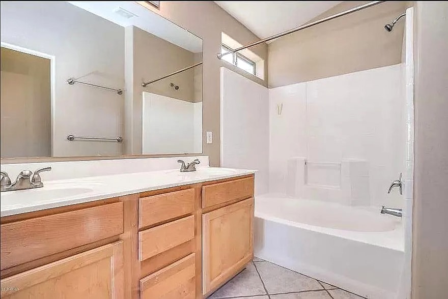 Master bedroom bathroom with dual sinks, shower and full-size bathtub - 10608 E Caballero St