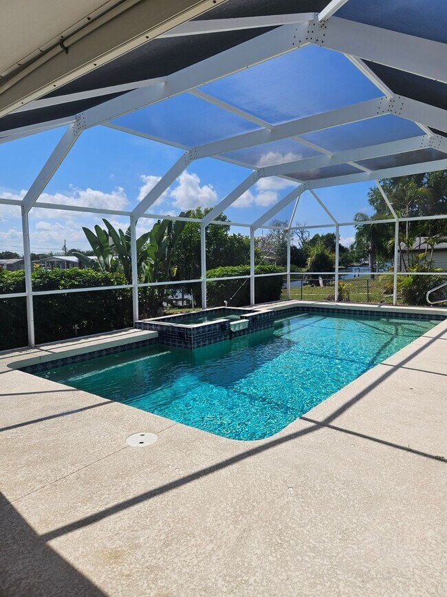 Building Photo - Port Charlotte Waterfront salt water pool annual rental