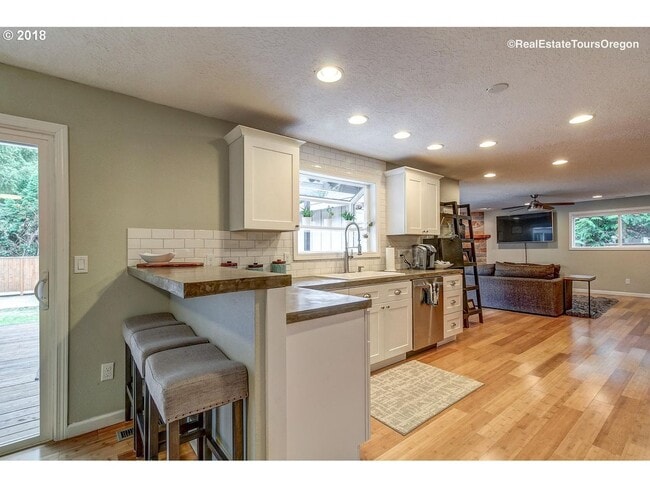 Building Photo - Spacious 4-Bedroom Home with Multiple Livi...