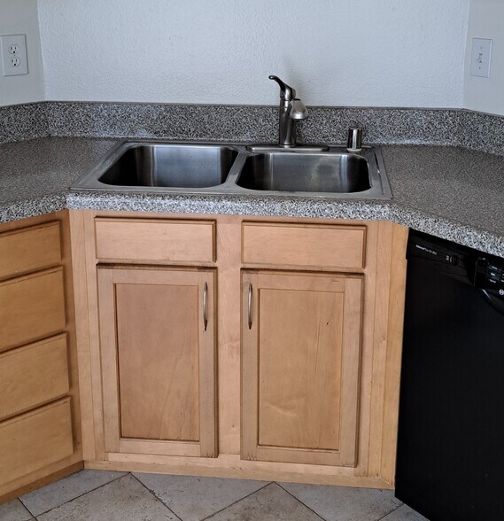 Stainless steel double sink with pull out faucet and garbage disposal. - 314 20th St