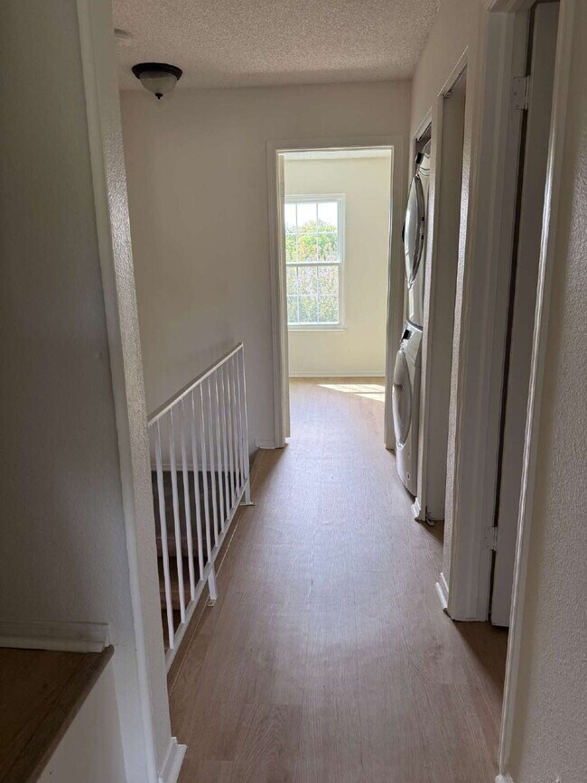 Building Photo - Cozy 2 Bed, 1.5 Bath Townhouse with Fireplace + Community Pool + Reserved Parking Space!