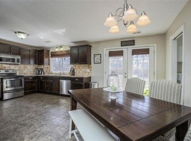 Building Photo - {5611} Updated OP Ranch + Two Car Garage + Fenced Yard and Stamped Concrete Patio Perfect for Spr...