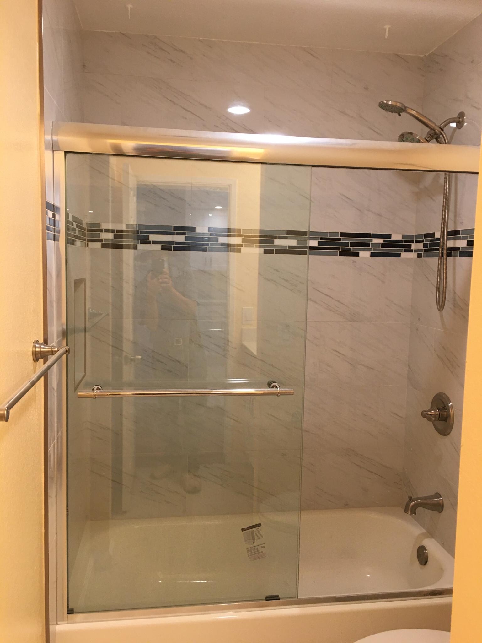 New bathtub, shower door, shower head, and towel rack - 5318 Borneo Cir