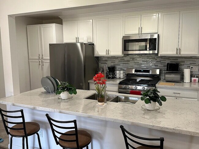 Building Photo - This beautifully remodeled 3-bedroom, 2-bathroom home is designed with an open concept layout