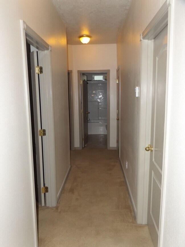 Building Photo - Spacious 3 Bedroom, 2 Bathroom Duplex with Two Car Garage and Fenced Yard!