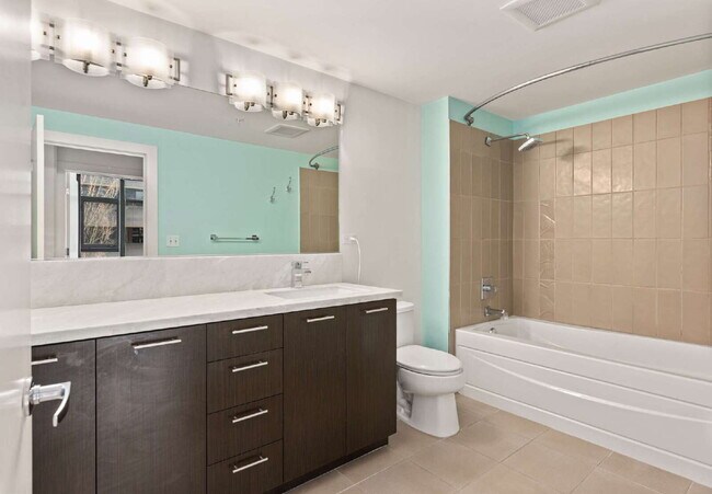 Building Photo - Open 2bdrm 1 bath with floor to ceiling windows!
