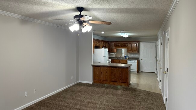 View of living room back into kitchen. - 1211 Goldridge Dr SW