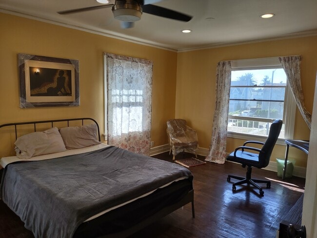 one of the large bedrooms upstairs. House can come furnished or unfurnished. - 2142 S Victoria Ave
