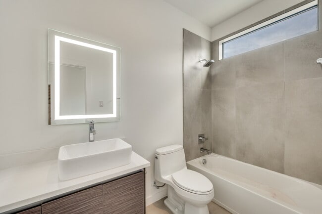 Building Photo - Live Above It All | Sleek Multi-Level Condo with Private Rooftop Deck