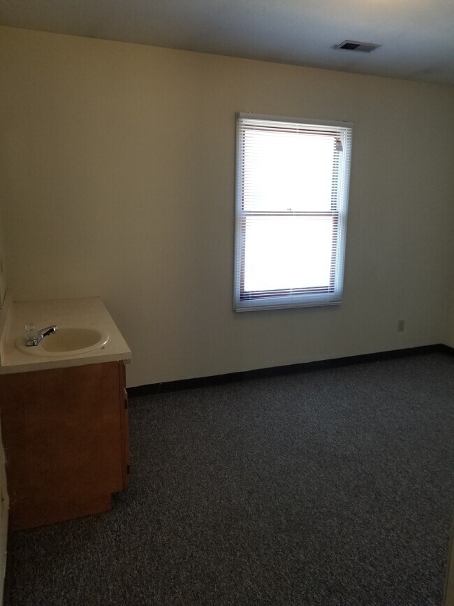 Bedroom #2 both have vanities with sinks - 1500 W University Ave