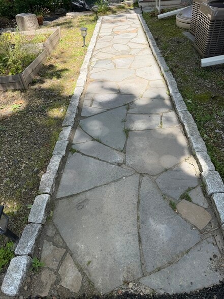 Private walkway with raised garden beds - 229 Miller Ave