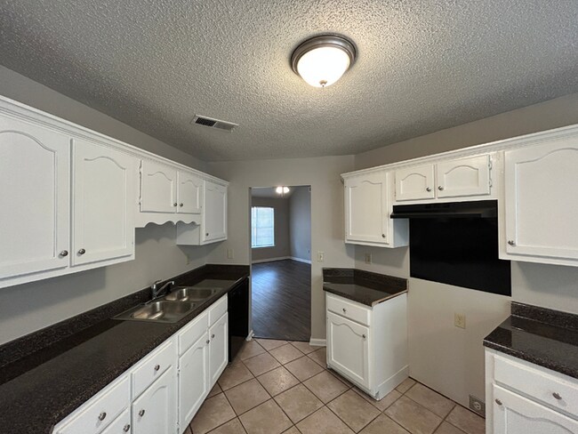 Building Photo - Spacious 3BR/2BA Lake Community Home | Soaring High Ceilings, Fireplace & 2-Car Garage