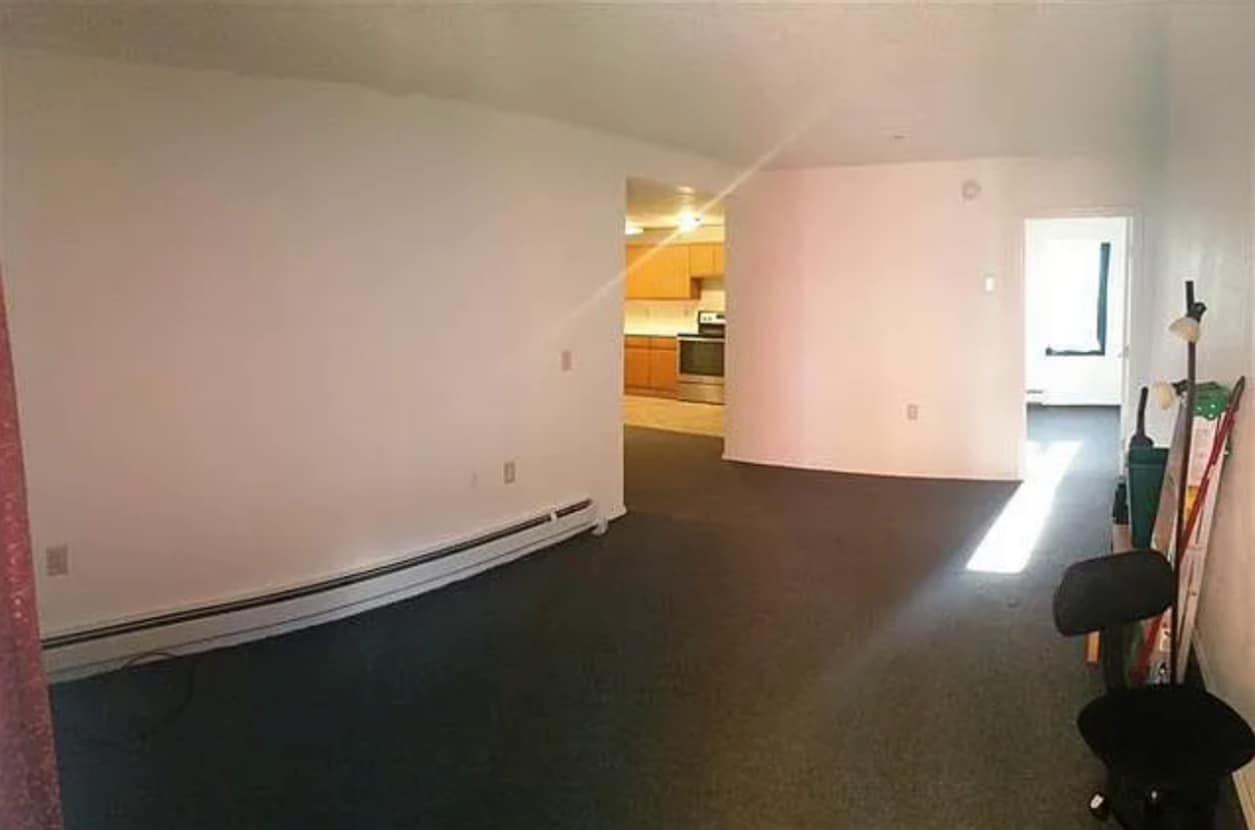 Living room with view into kitchen and bedroom - 3483 Rewak Dr