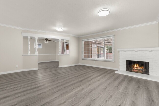 Building Photo - Charming Updated Home With Drive-Through Garage Access