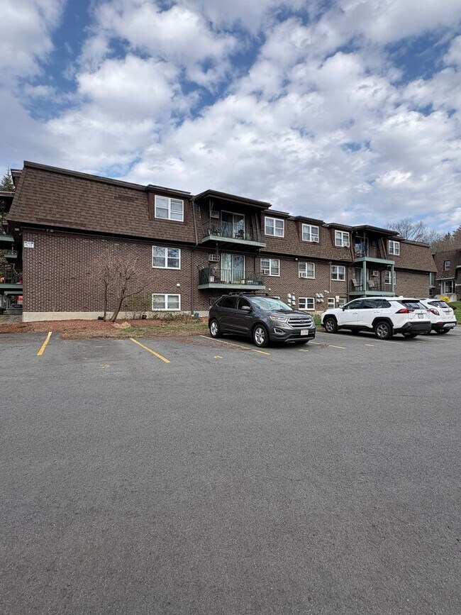 Building Photo - Rent reduced! Beautifully updated 2 bedroom condo, with 2 reserved parking spots, in Dracut MA