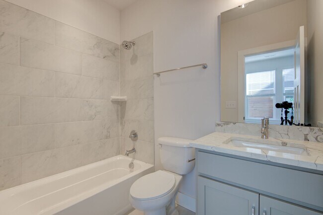 Building Photo - COMING SOON! Modern End-Unit Living Near Uptown | Rooftop Terrace + Tandem Garage