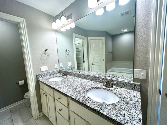 Building Photo - Gorgeous Home with Vaulted Ceilings and La...