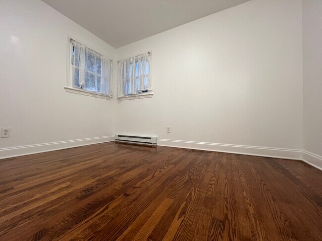 Bedroom 2 with hardwood floors, heat, and closet (not pictured) - 73 Swannanoa Ave