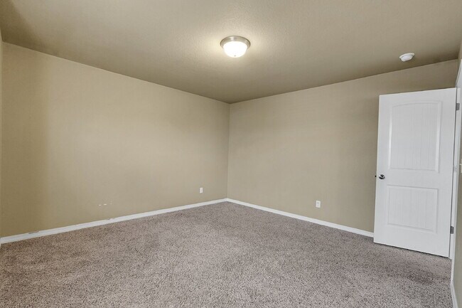 Building Photo - $2,490.95 - 4 Bed, 2.5 Bath Home in CO Springs with Fenced in Yard and 3 Car Garage!