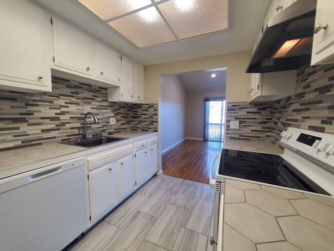 Building Photo - Private 2x2 Santa Rosa Townhouse with pool, 2-car garage, workshop area, fireplace, W/D Hookups