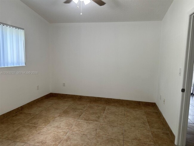 Building Photo - 9491 Palm Cir S