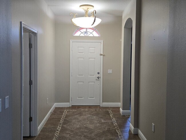 Building Photo - Freshly Painted 4BR/2BA Pool Home with Screened Pool & Spa – Move-In Ready!