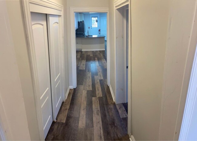 hallway from living room to kitchen (has half bath and closet) - 106 S 3rd St