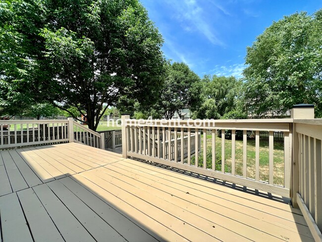 Building Photo - Updated Kitchen, Large Two Tiered Deck, Finished Basement in Blue Valley Schools!