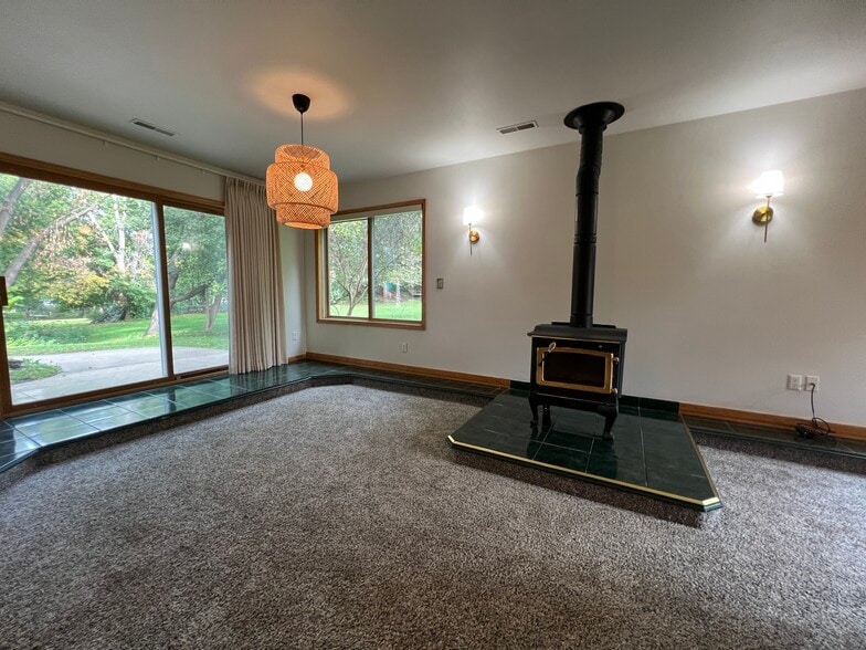 Family Room with Wood Stove and walkout - 118 S Shannon Dr
