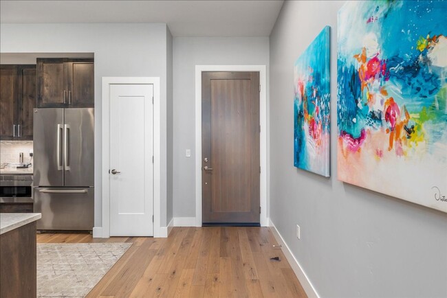 Building Photo - COME HOME TO REFINED DOWNTOWN LUXURY CONDO...