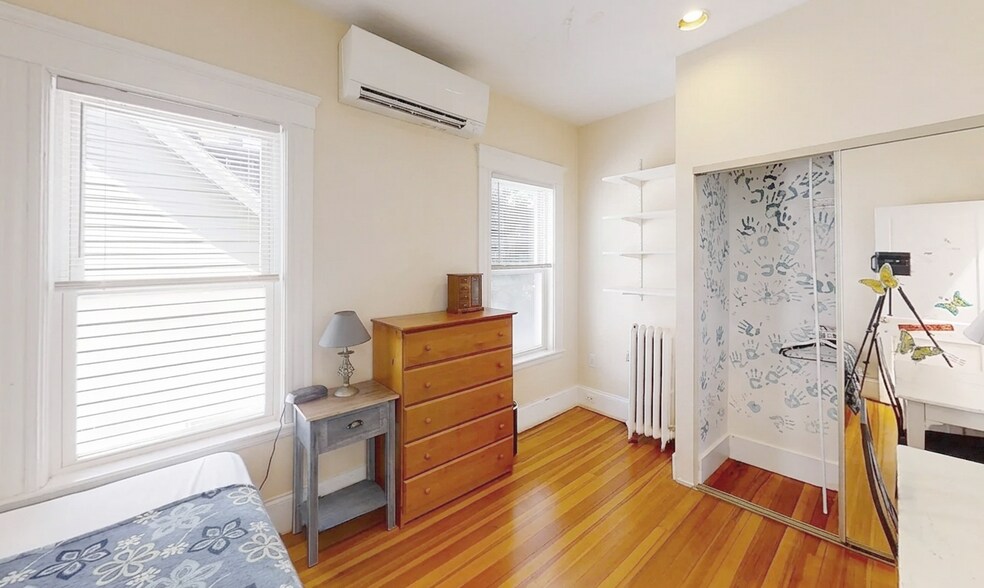 Bedroom #2 pre-repairs. Two large windows. - 307 Tappan St