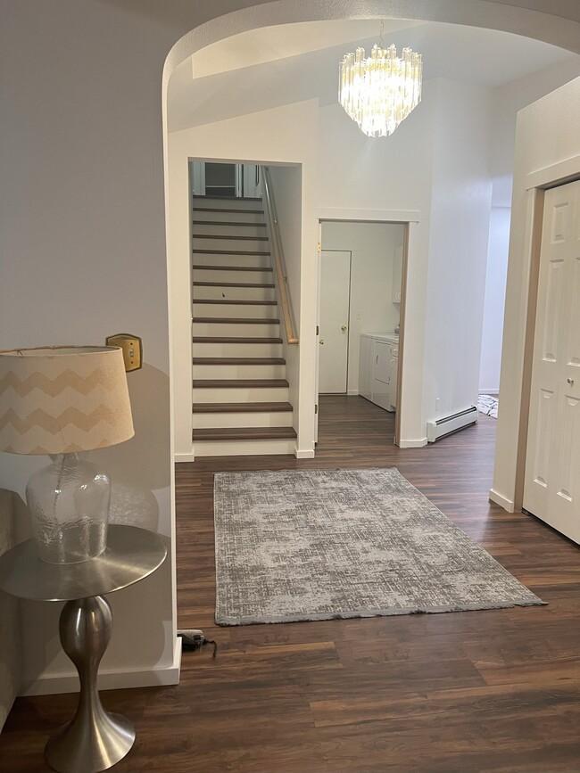 Entryway and stairs to upstairs room - 1005 Woodland Dr