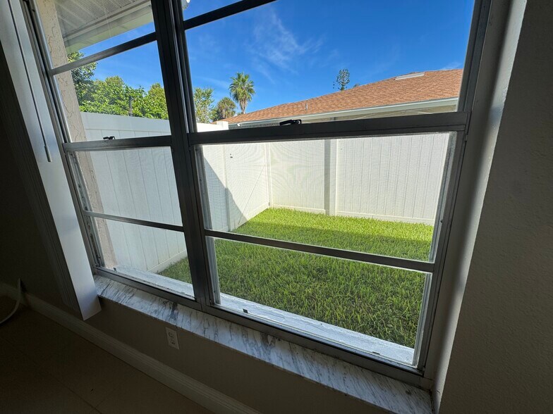 All bedroom windows surrounded by privacy fence. - 3633 Country Club Blvd