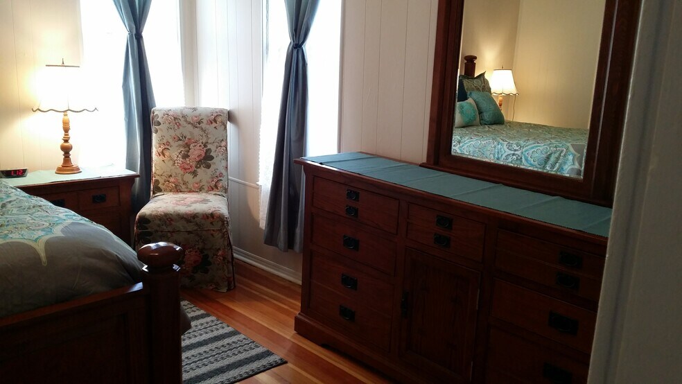Back bedroom - large dresser and chair (furnishings not included with rental) - 607 Harrison Ave