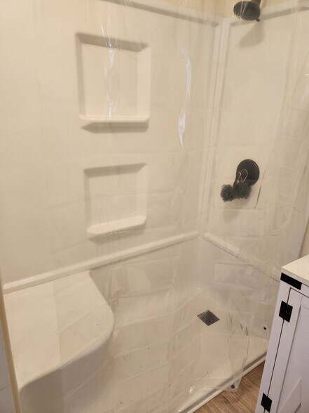 New walk in shower with bench seat - 1424 Avenue A