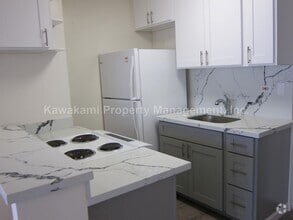 Building Photo - Conveniently Located, Renovated Condo w/Pa...