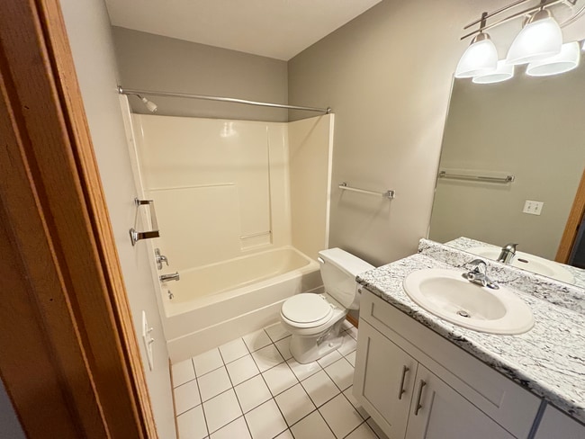 Building Photo - **$300 Off Move In Special** Spacious 3 Bedroom Townhome with Vaulted Ceilings, Fireplace & Attac...