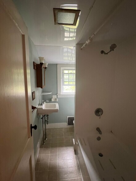 bathroom with bathtub - 104 Main St