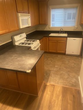 Building Photo - LIKE NEW three bedroom with fantastic updates, one car garage and private newly fenced front patio!