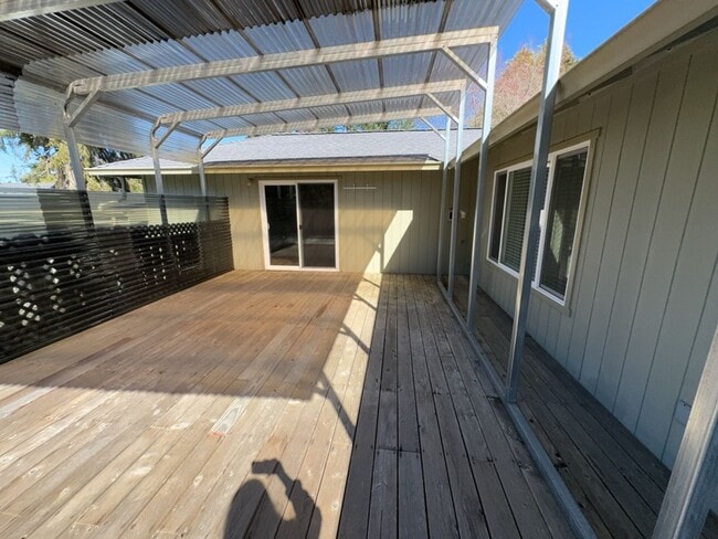 Building Photo - Newley updated 3-bedroom home features fenced yard, garage, and covered patios!
