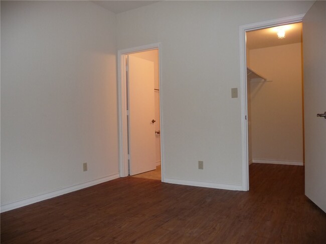 Bathroom and large walk in closet for bedroom one. - 1910 Robbins Pl