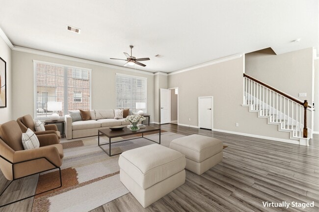 Living Room with Crown Molding and Half Bath (Plan 3301) - Villas at Kings Harbor