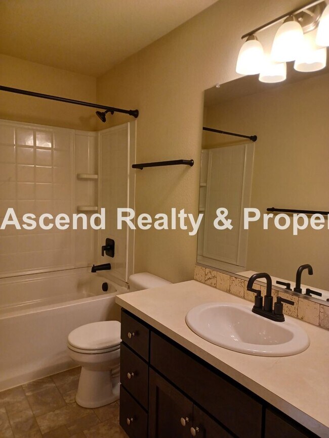 Building Photo - 3 Level End Unit Townhome with Newer Carpet, Open Floor Plan, 2 Balconies, 2 Car Attached Garage ...