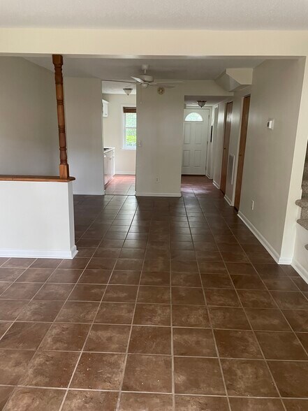 Living room looking into dining area, kitchen and entry way - 109 Heritage Cir