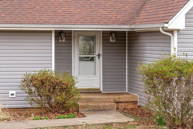 Building Photo - Lovely home on beautiful, wooded corner - Just Reduced