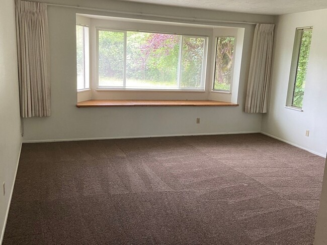 Building Photo - New Paint & Flooring.  Large yard and over...