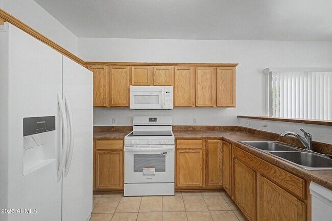 Building Photo - 8777 W Dahlia Dr