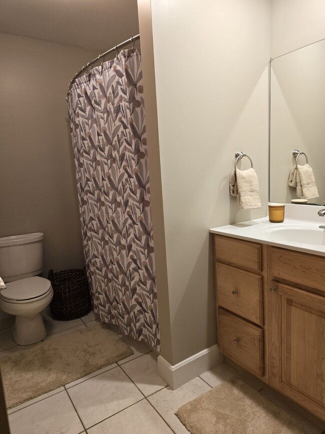 Bathroom. Maple cabinets and ceramic tile floor. - 5040 Postlewaite Rd