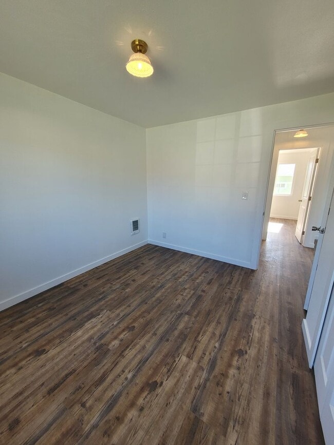 Building Photo - Free May rent with 1 Year Lease - Fully Remodeled with Garage & Yard Care Included