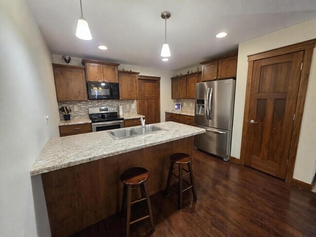 Building Photo - FREE SEPTEMBER RENT for this Spacious 4-Bedroom Home with Vaulted Ceilings with Finished Basement...